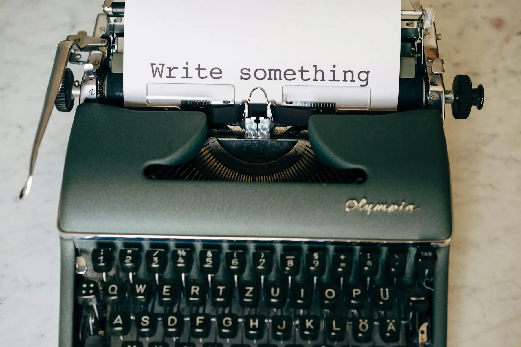 Vintage typewriter with paper reading Write something